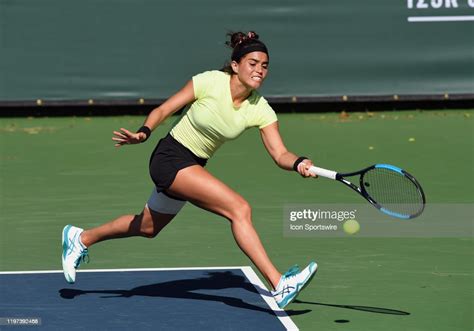 Wta Tennis Player Ana Sofia Sánchez Chases After The Ball In A Match