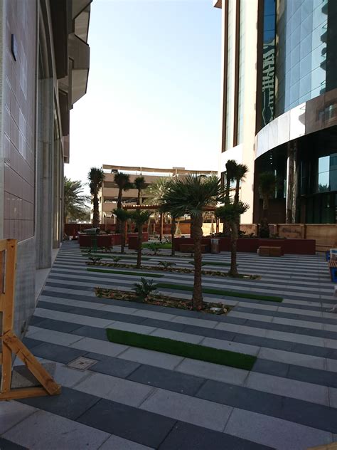 Busy city life, day traffic on the street, a lot of car and red taxi on road, people on the sidewalk. Landscaping & Irrigation Works Along Sheikh Zayed Road ...