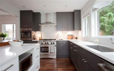 Maybe you would like to learn more about one of these? Dark grey shaker cabinets paired with white quartz ...