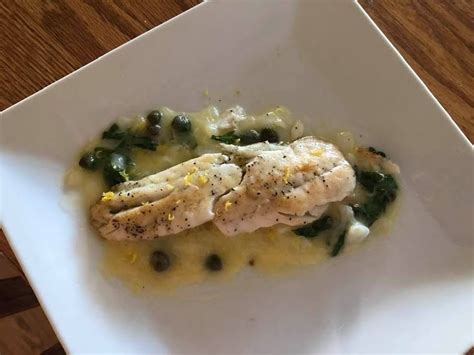 Grilled Sea Bass With Lemon Caper Butter Sauce Just A Pinch
