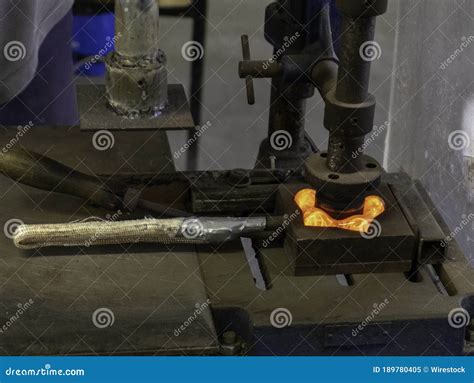 Closeup Shot Of Molten Glass In Being Pressed In A Mold Making A Glass Candle Holder Stock