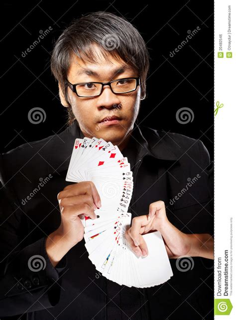 Over 70% new & buy it now; Asian magician with cards stock photo. Image of young - 20482546