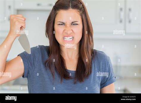 Woman Holding Knife Looking Angry Hi Res Stock Photography And Images