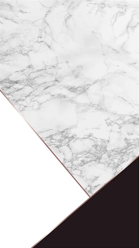 A White And Black Marble Counter Top With Gold Trim On The Edges In An