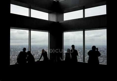 Silhouettes Of Unrecognizable Tourist People Admiring Skyline Views