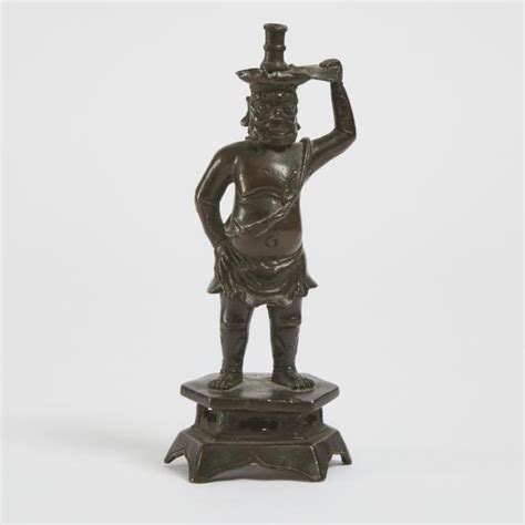 A Bronze Foreigner Candlestick Ming Dynasty 17th Century 明 十七世纪 铜胡人献宝烛台 Barnebys