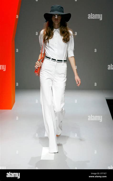 DKNY New York Ready To Wear Spring Summer Floppy Hat And Flared High Waist Trousers Stock Photo