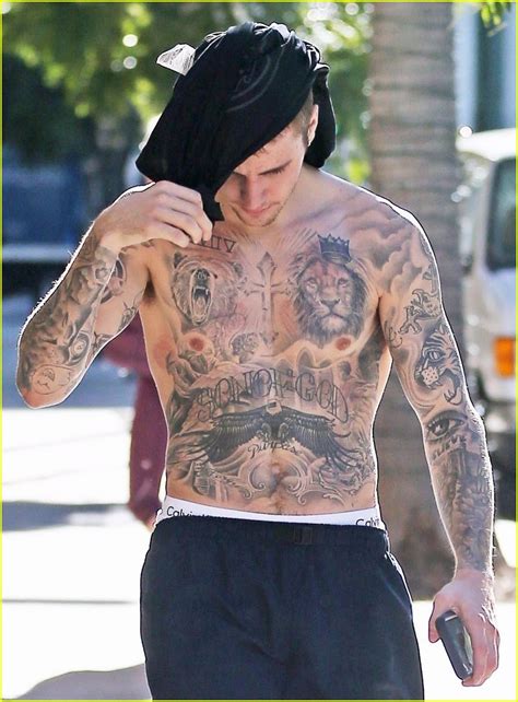 Since bursting onto the scene in 2008 (after being discovered on youtube). Shirtless Justin Bieber Puts His Muscles & Tattoos on ...