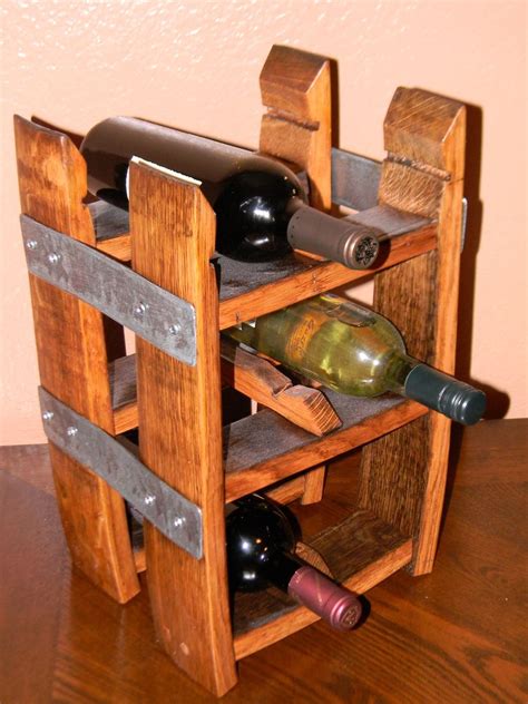 The bar is wrapped in whiskey staves. Wine barrel stave table top wine rack by Living Oak ...