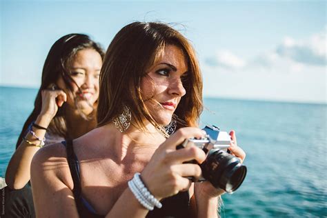 Young Woman Using Camera Del Colaborador De Stocksy Simone Wave