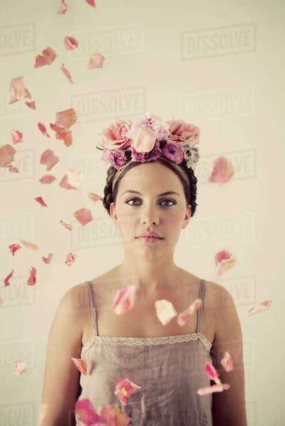 Serious Woman Wearing Flowers In Her Hair Stock Photo Dissolve