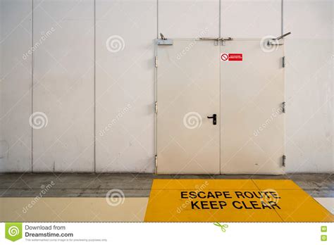 Emergency Exit Door With Keep Clear Warning Message On