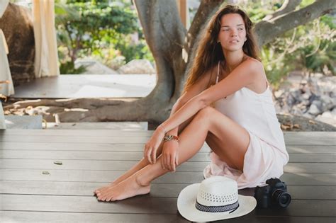 Free Photo Young Woman Sitting On Floor Barefoot In Pale Dress