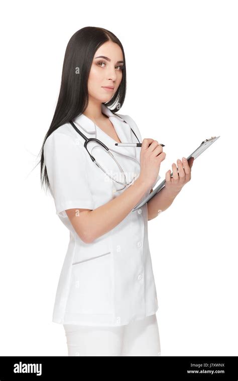 Pretty Nurse With Stethoscope Around Neck Registrating Patient Stock