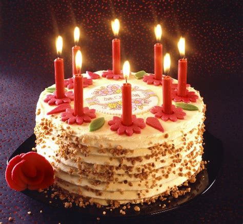 birthday cake with burning candles license images 925410 stockfood