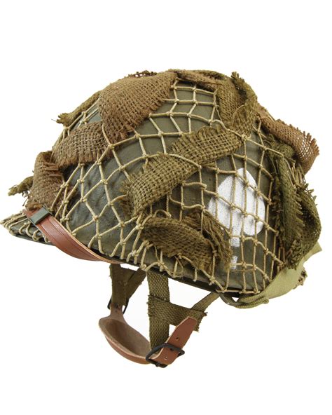 Hawaiian feather helmet (made in the eighteenth century). US WWII "506th" M2 Paratrooper Helmet, made in USA