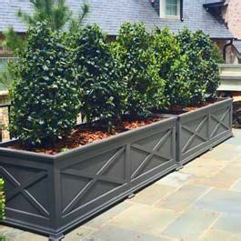 Is there anywhere that chalkboard paint can't go? long, custom grey planter with X pattern design on front ...