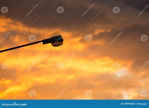 Street Light Against Twilight Background From Sunset And Clouds Stock