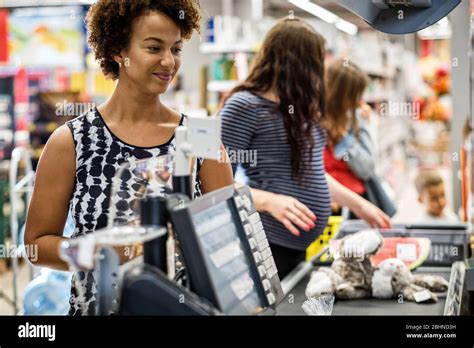 African American Woman Buying Goods In A Grocery Store Stock Photo Alamy