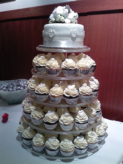 White wedding cupcake tower | Vanilla and raspberry cupcakes… | Flickr