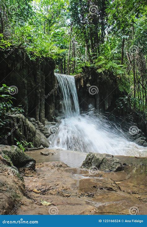 Waterfall In Erawan Falls Located In Tropical Forest At Erawan