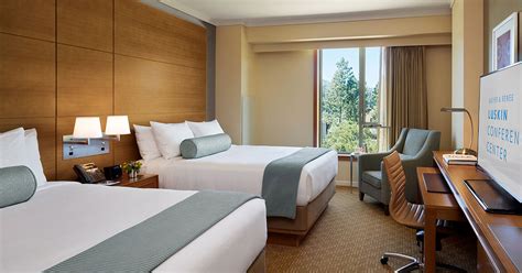 As many more stand behind their chairs. Hotel Near UCLA | Luskin Center | Los Angeles, CA