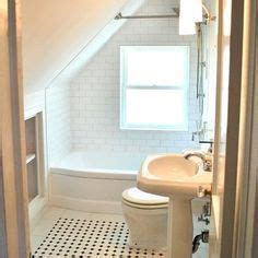 Putting the shower over the bath offers both washing options in the same space. bathroom in bungalow Upstairs sloped ceiling - Google Search | Small attic bathroom, Small ...