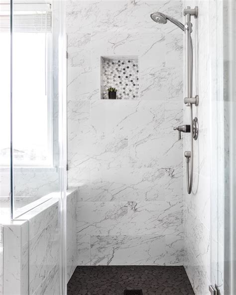 Marble Shower With Black Tile Floors Sleek Light And Bright Bathroom