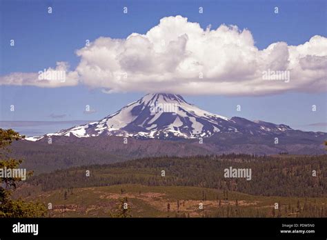 A Large Cumulus Cloud Sits Atop Mount Jefferson Oregons Second