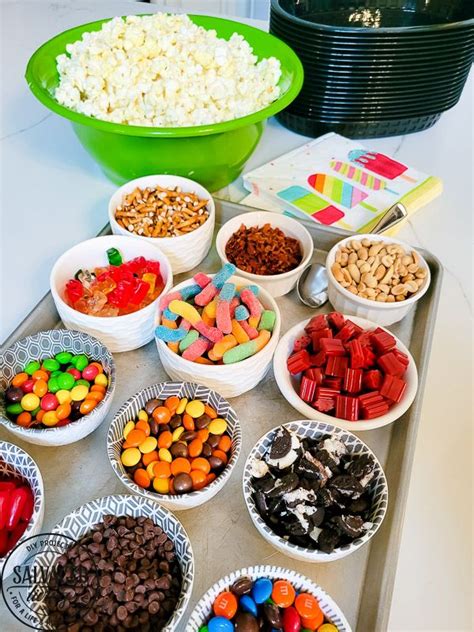 Topping Ideas For The Perfect Popcorn Bar Salvaged Living Gourmet Popcorn Bar Popcorn Bar