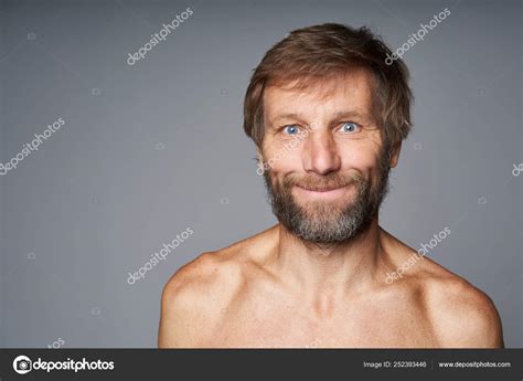 Mature Man Shirtless Standing Smiling At Camera Stock Photo By Pavel Kolotenko