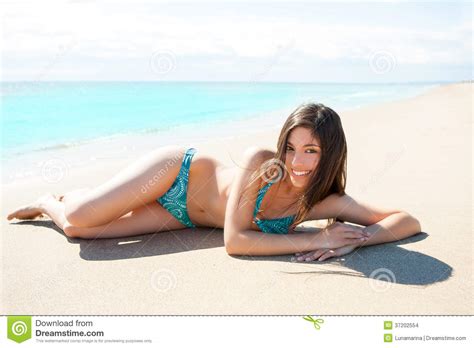 Asian Brunette Girl Lying On The Summer Beach White Sand