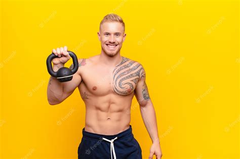 Premium Photo Young Muscular Man Looking Happy