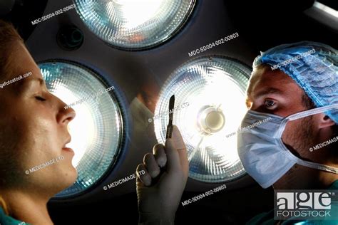 A Male Surgeon Prepares To Make The First Incision Stock Photo Picture And Rights Managed
