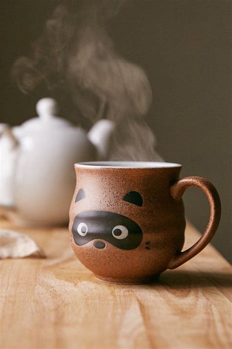 The mouth on the face mug is wide enough to stash one doughnut, a few cookies or whatever else you can dream up. Urban Outfitters - Raccoon Face Mug | Pottery mugs, Mugs ...