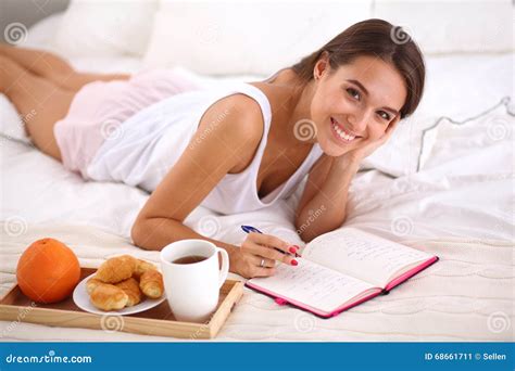 Young Beautiful Woman Lying In Bed Writing A Diary Stock Image Image