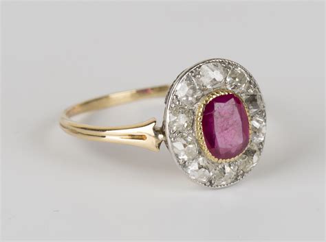 Maybe you would like to learn more about one of these? A gold, Burmese ruby and diamond oval cluster ring, collet ...