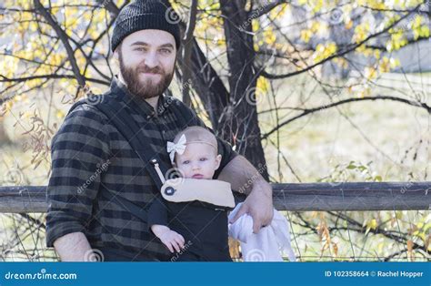 Millennial Dad With Baby In Carrier Outside Walking Stock Photo Image