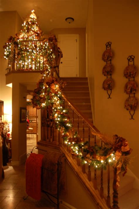 For a light, airy, and cheerful look, try stringing red and white paper bells together. Decorate The Staircase For Christmas - 45 Beautiful Ideas ...