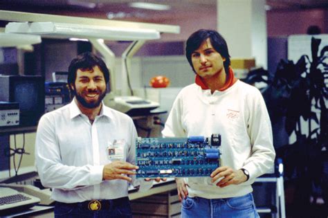 Apple Founders Steve Wozniak And Steve Jobs Holding An Apple I Circuit