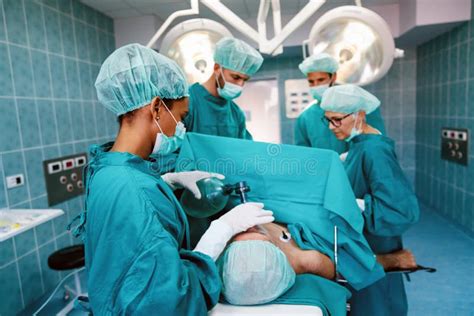 Group Of Surgeon Team At Work In Operating Room In Hospital Stock Image