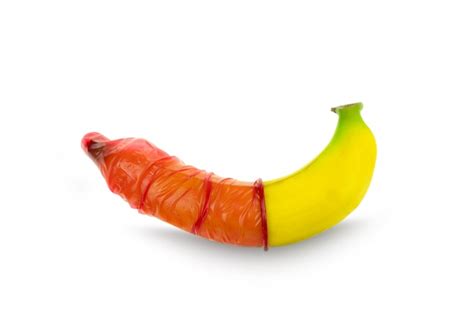 Premium Photo Red Condom Wear A Banana Concept Safe Sex Prevention Of Sexually Transmitted