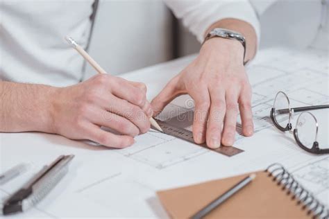 Cropped Shot Of Architect With Ruler And Pencil Working On Project At