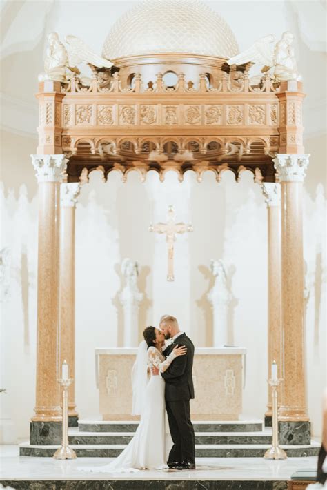 Classic Florida Bride And Groom Kiss At The Altar Of Saint Mary Our