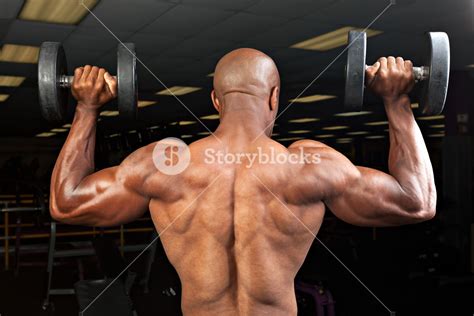 Strong Back And Shoulders On A Ripped Lean Muscle Fitness Man Lifting