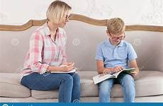 sofa shirt female notebook tutor plaid sitting notes boy making young his blue her preview