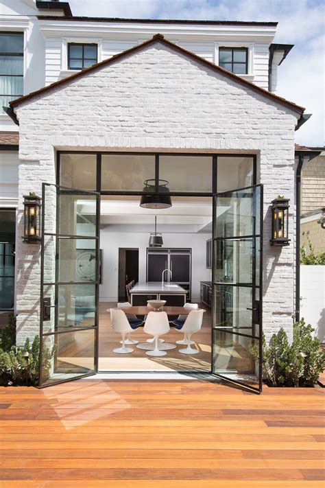In addition, parts of the facade were covered with wood. Modern Cape Cod Home Design - Home Bunch Interior Design Ideas