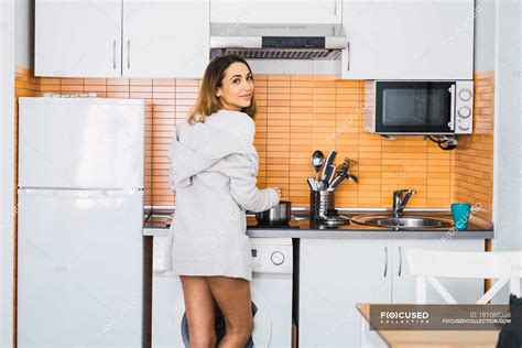 Young Woman Cooking On Kitchen And Looking At Camera — Portrait Room