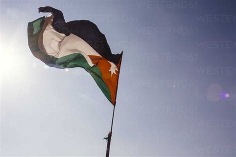 Jordan View Of Jordan National Flag Against Sky Stock Photo