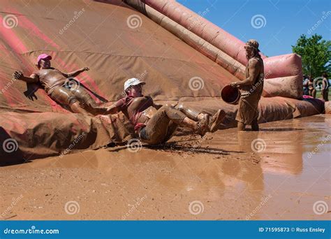 Women Slide Into Muddy Pit At Dirty Girl Mud Run Editorial Stock Photo